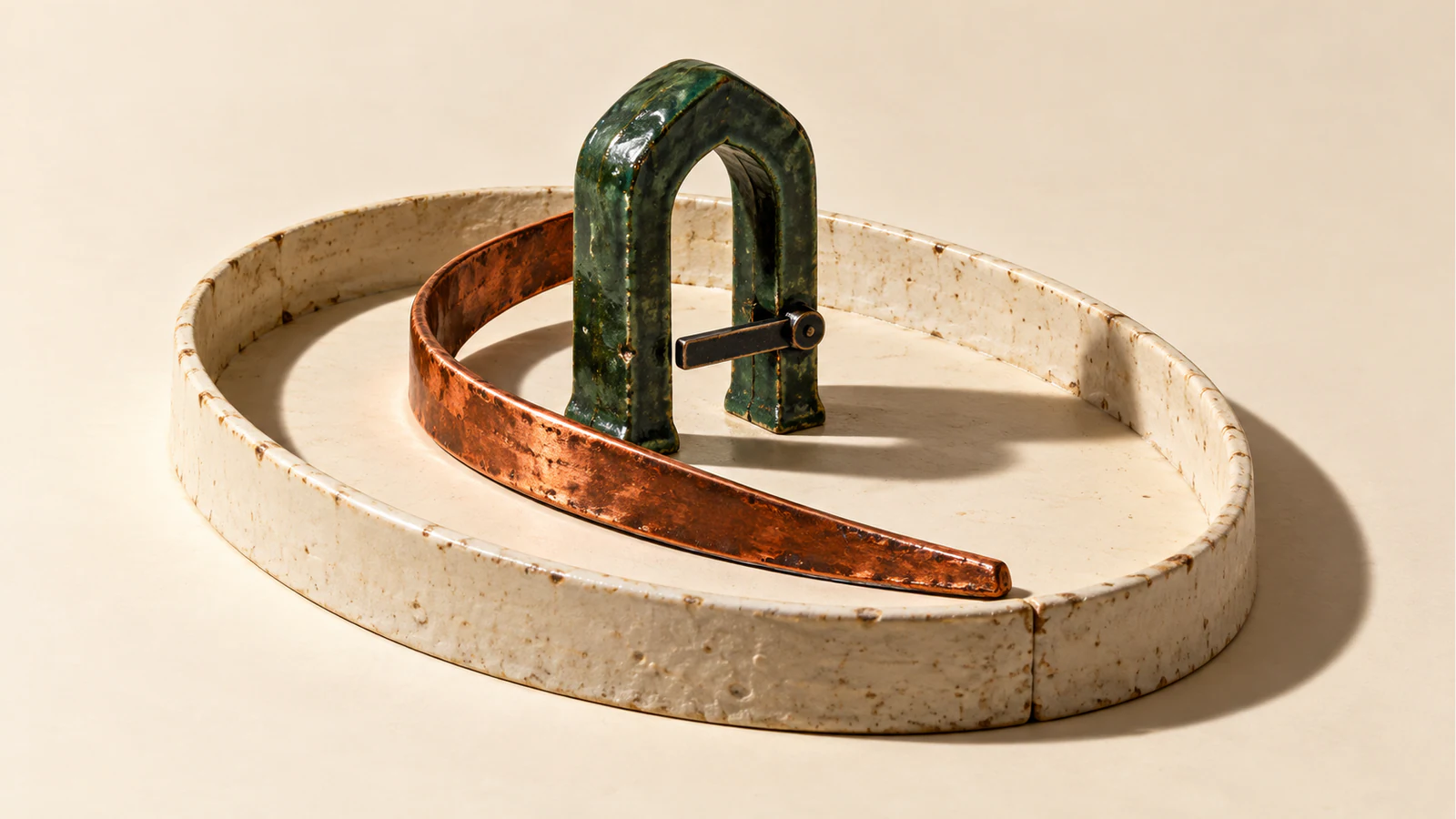 A copper-colored ribbon curves around a green ceramic checkpoint with a black gate arm, all inside a low, seamed ivory enclosure casting hard shadows.